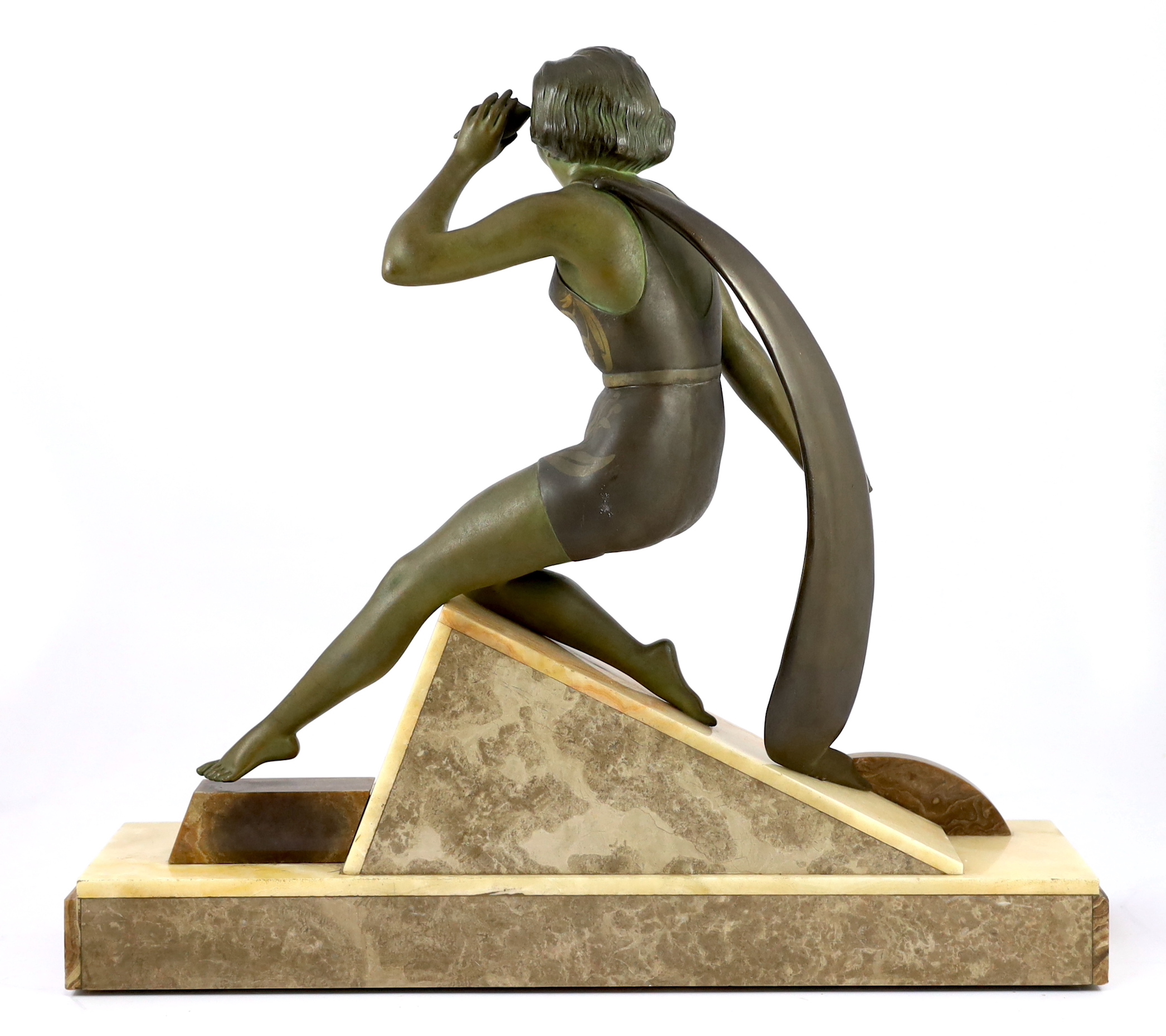 A French Art Deco bronzed spelter and marble figure of a bathing beauty, 58cm wide, 15cm deep, 53cm high